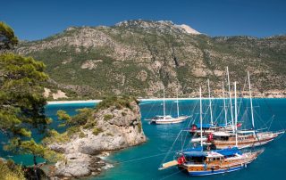 Boats docked on the shore of Fethiye, Turkey, one of the best day trips from Rhodes.