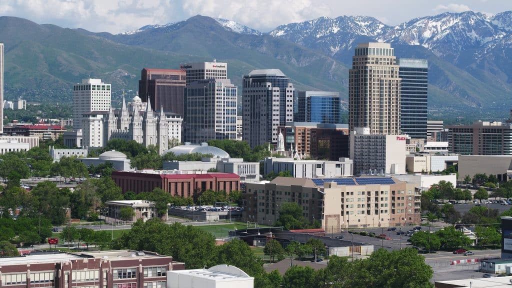 Snow covered mountains behind the landscape of Salt Lake City, Utah, one of the most underrated US cities